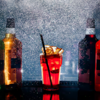 vista-frontal-diferentes-bebidas-coloridas-dentro-botellas_140725-14407